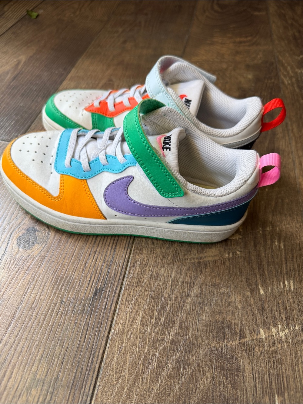 Nike Kids White Sneakers with Green Strap, Purple Swoosh & Orange Accents